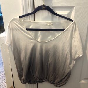 Collection of women’s shirts and sweaters